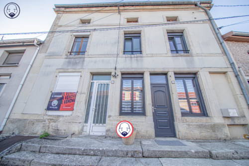 Maison comprenant deux lots avec garage
